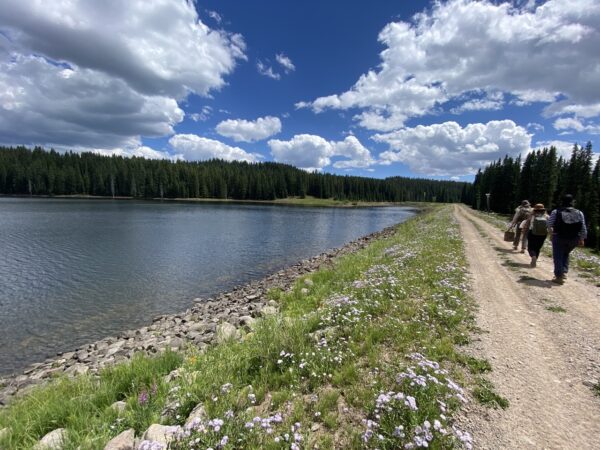 Walking along a reservoir studying water policy in Colorado