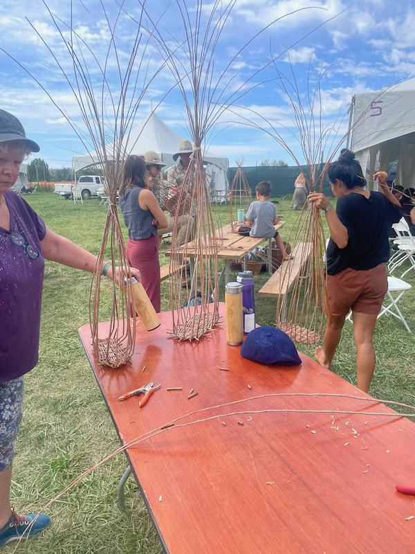 weaving willow basekts on picnic tables