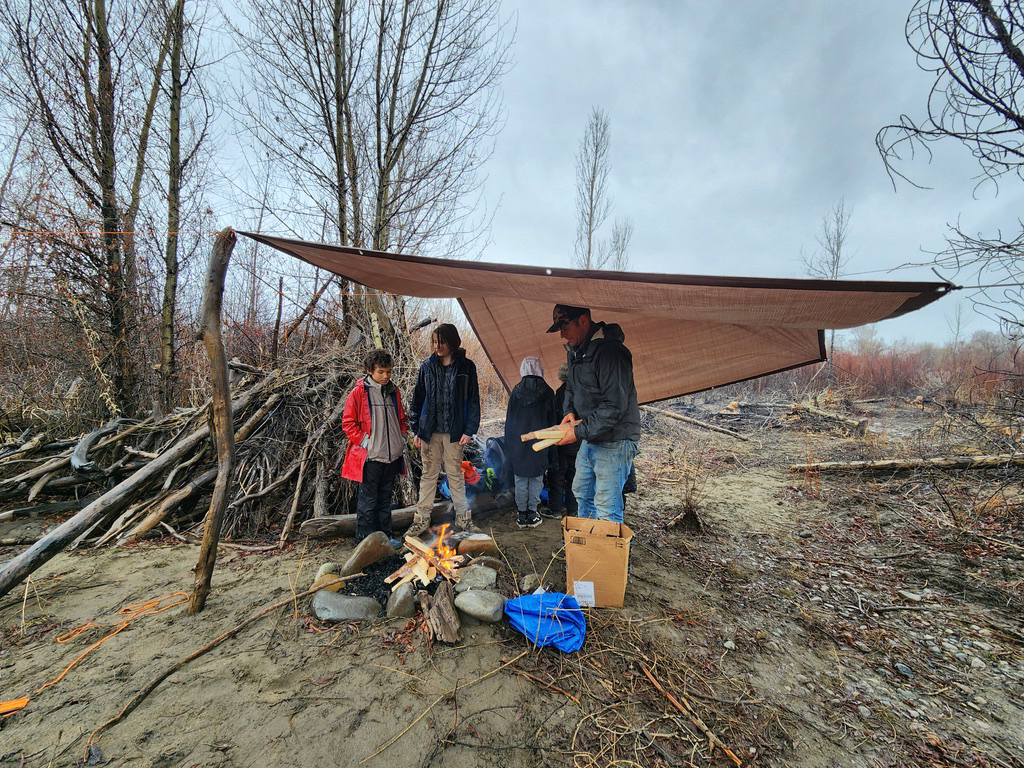 Campfire under a tarp